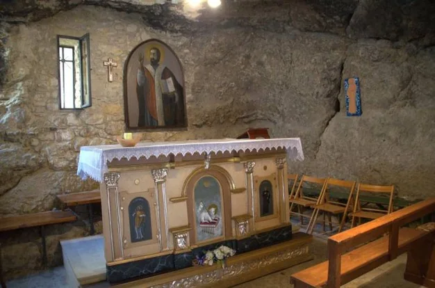 The altar in the Cave of San Filippo, set within a rocky chamber in Agira.