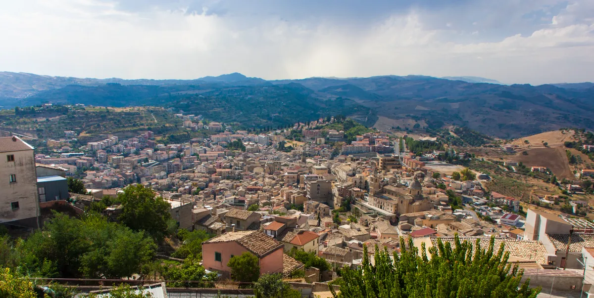 A view across the rooftops of Agira towards the surrounding hills.